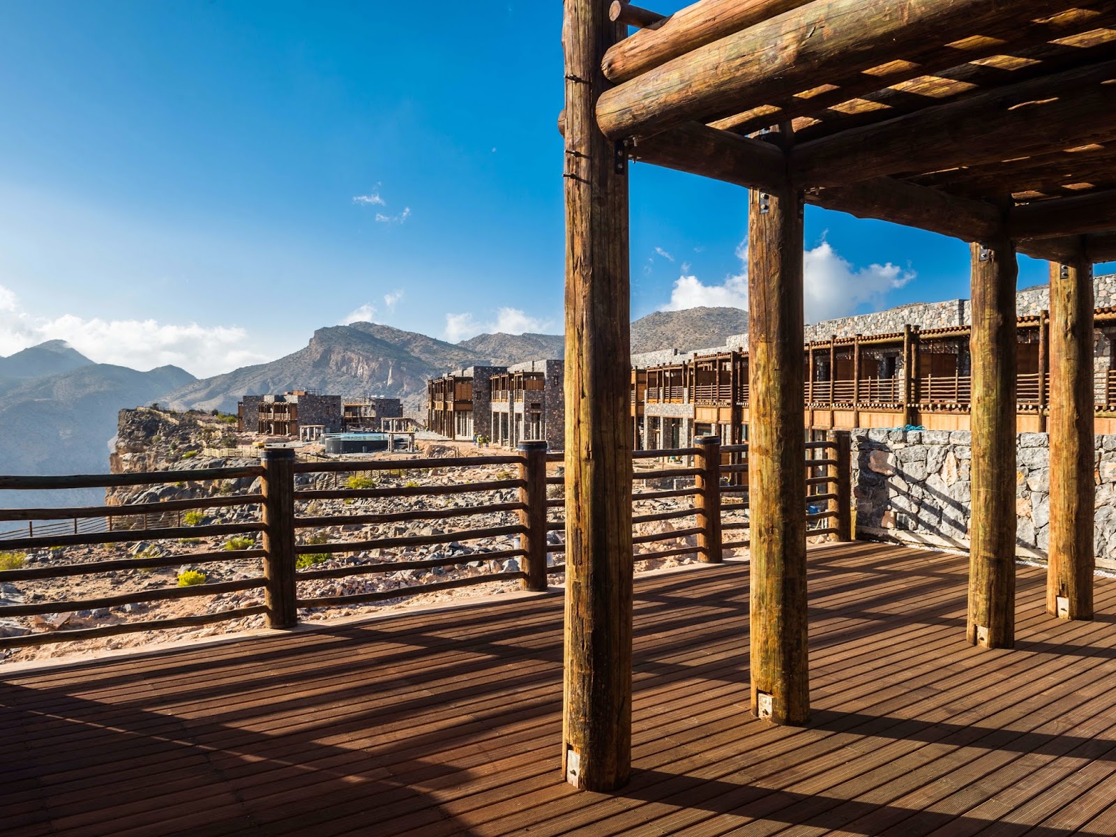 wooden terrace, blue skies and mountain views
