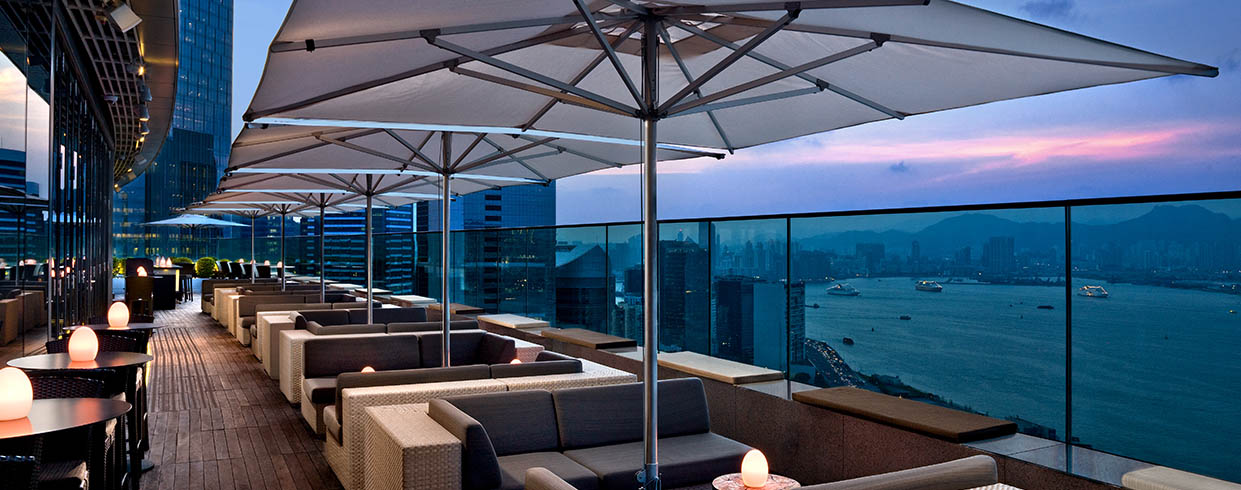 outdoor seating, umbrella and city view