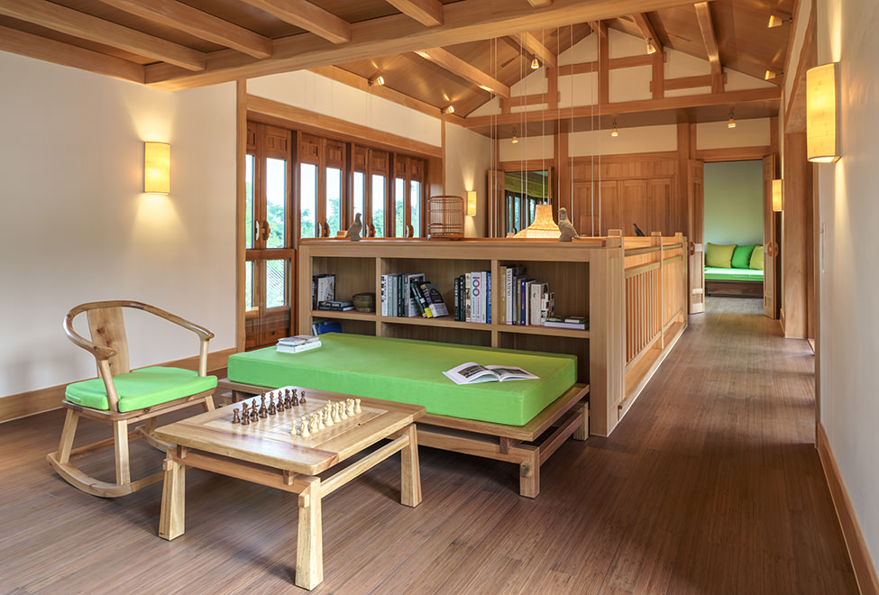 wood and green decorated library and games room