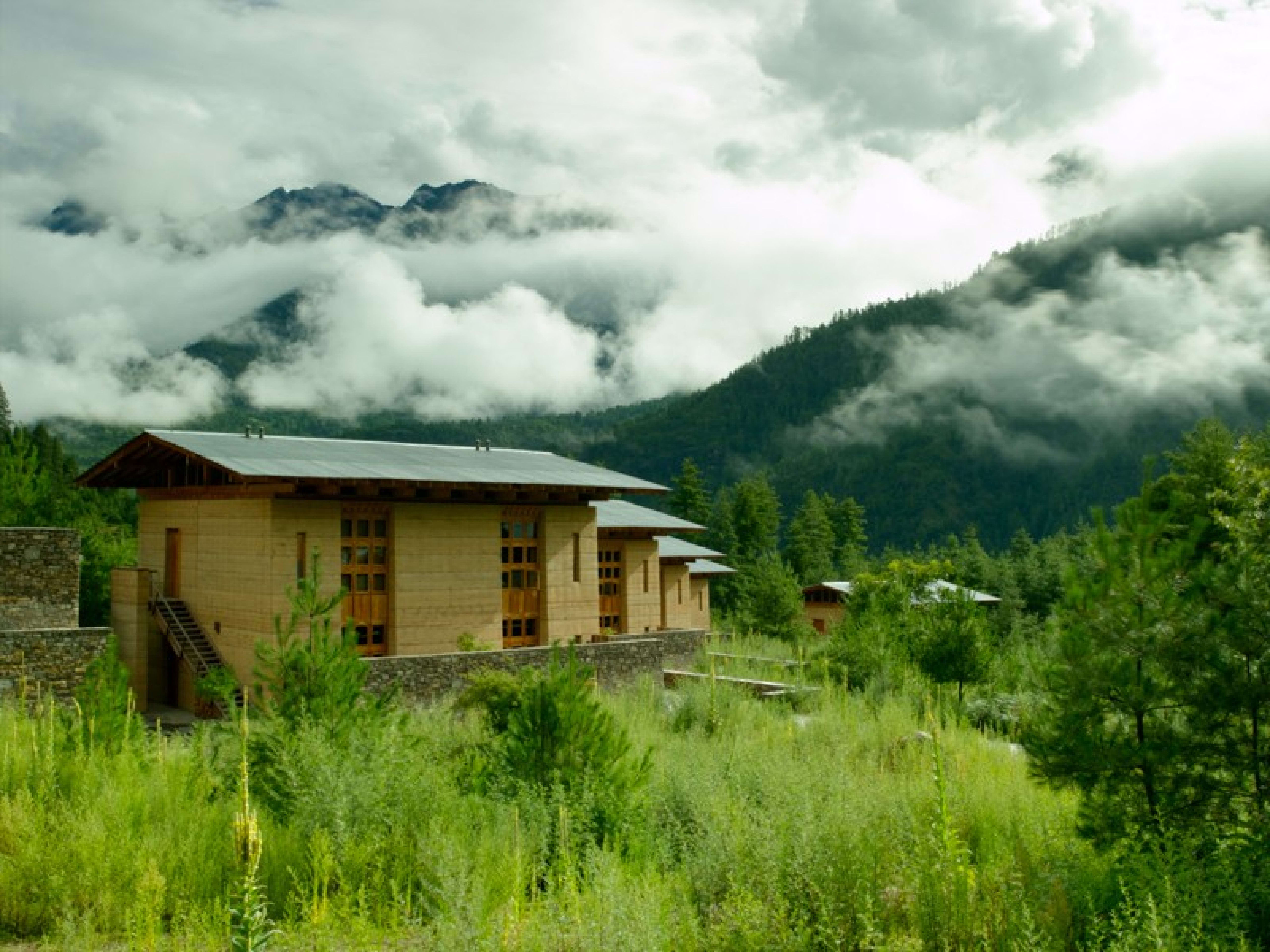 wooden lodging, green misty mountains