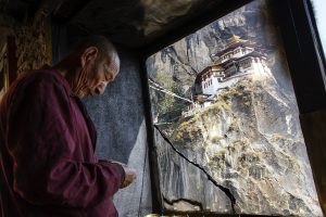 monk in robes, cliffside monastery