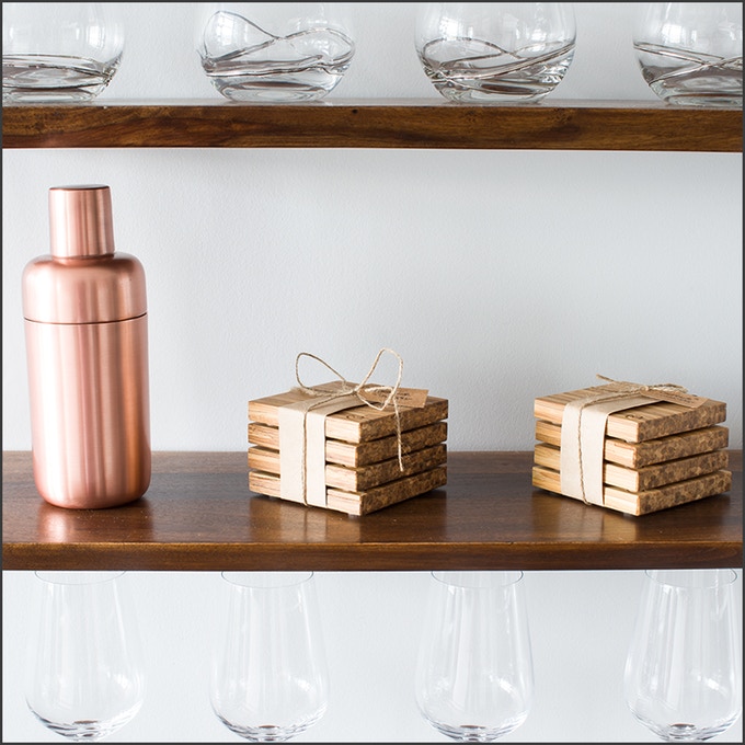 wooden coasters on shelf, wine glasses