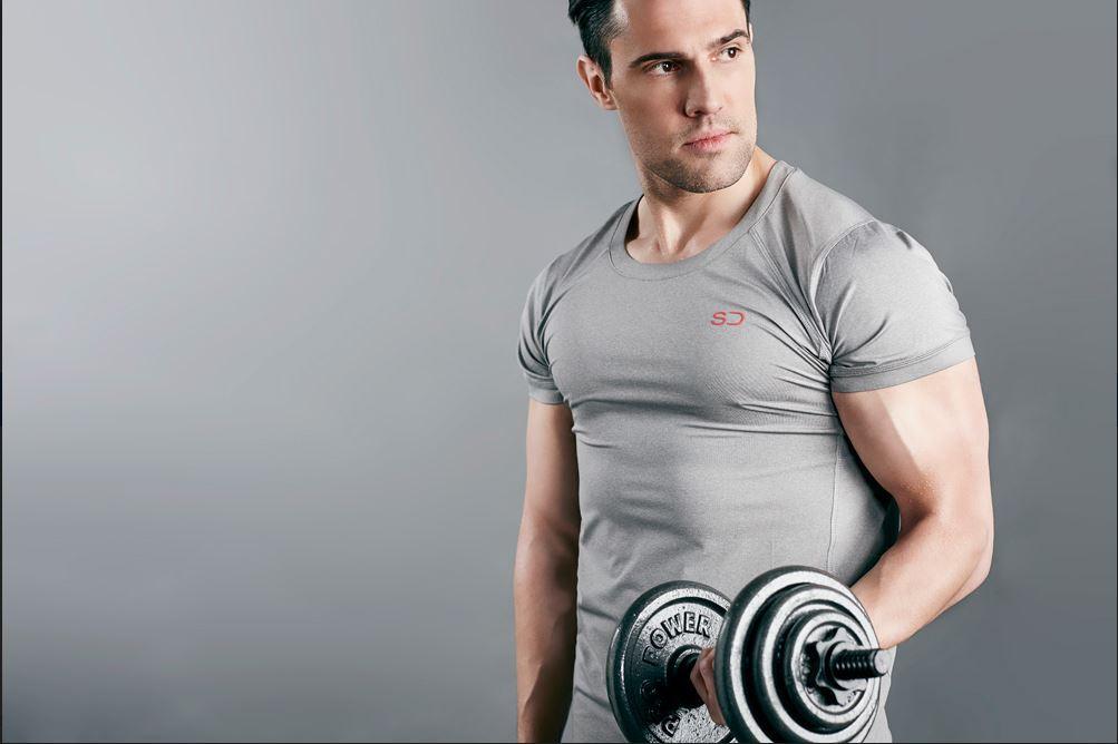 fit man in tight tshirt, lifting arm weight