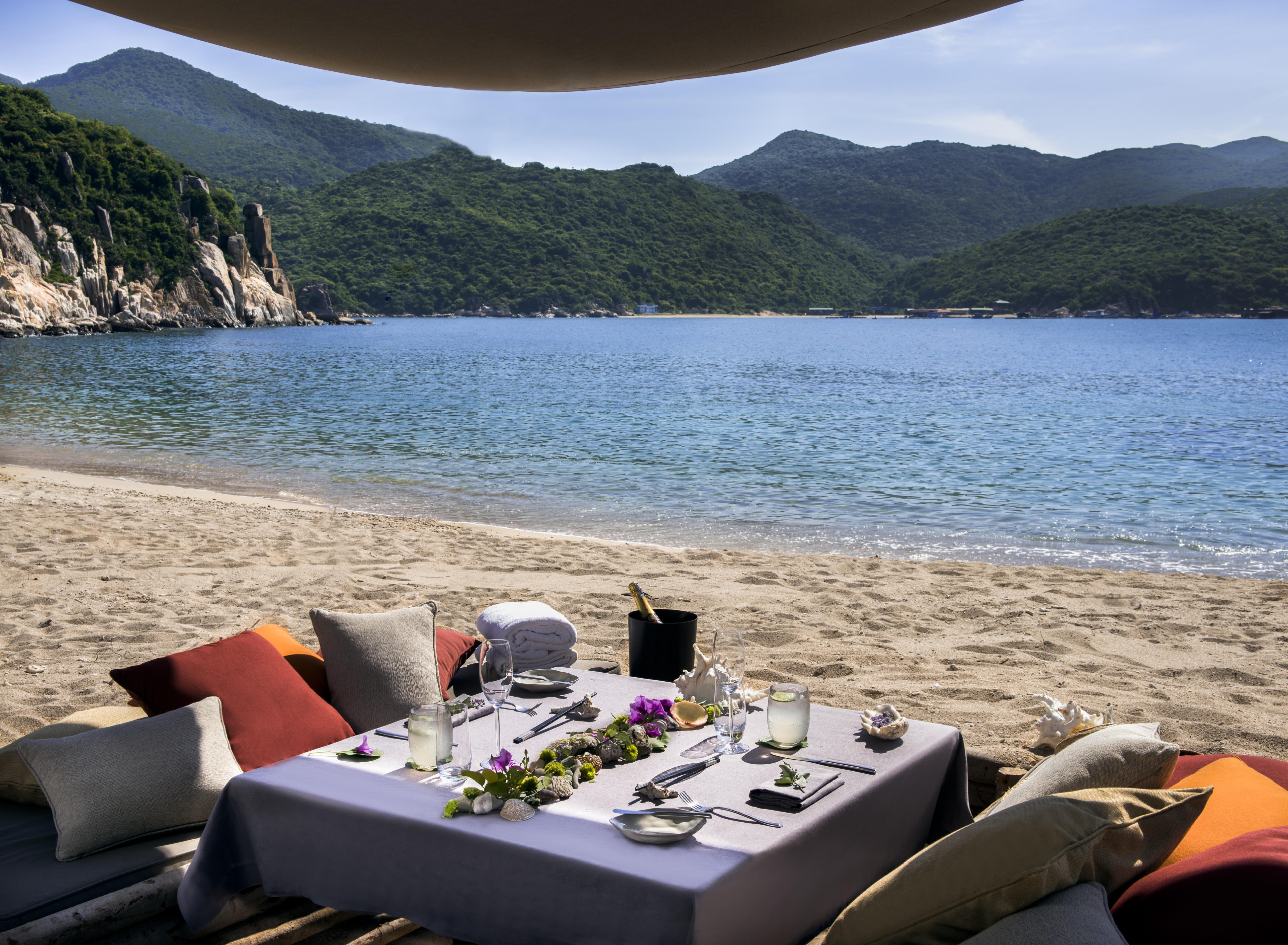 table on sand, beach dining
