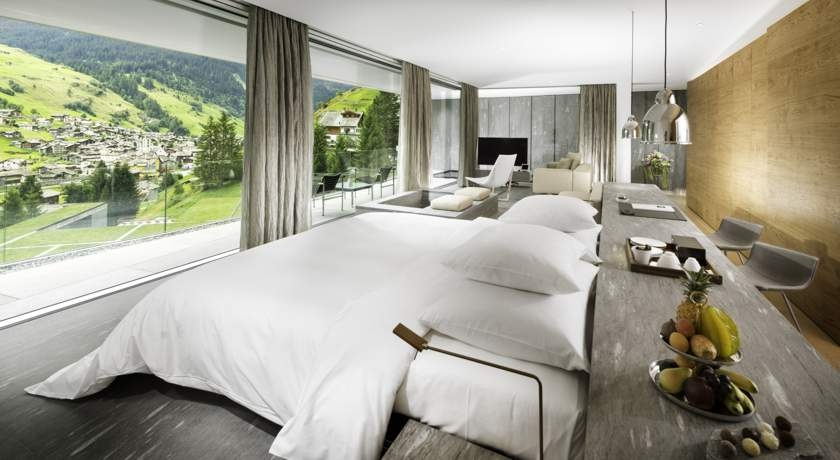 hotel suite, neutral colour, green mountain view
