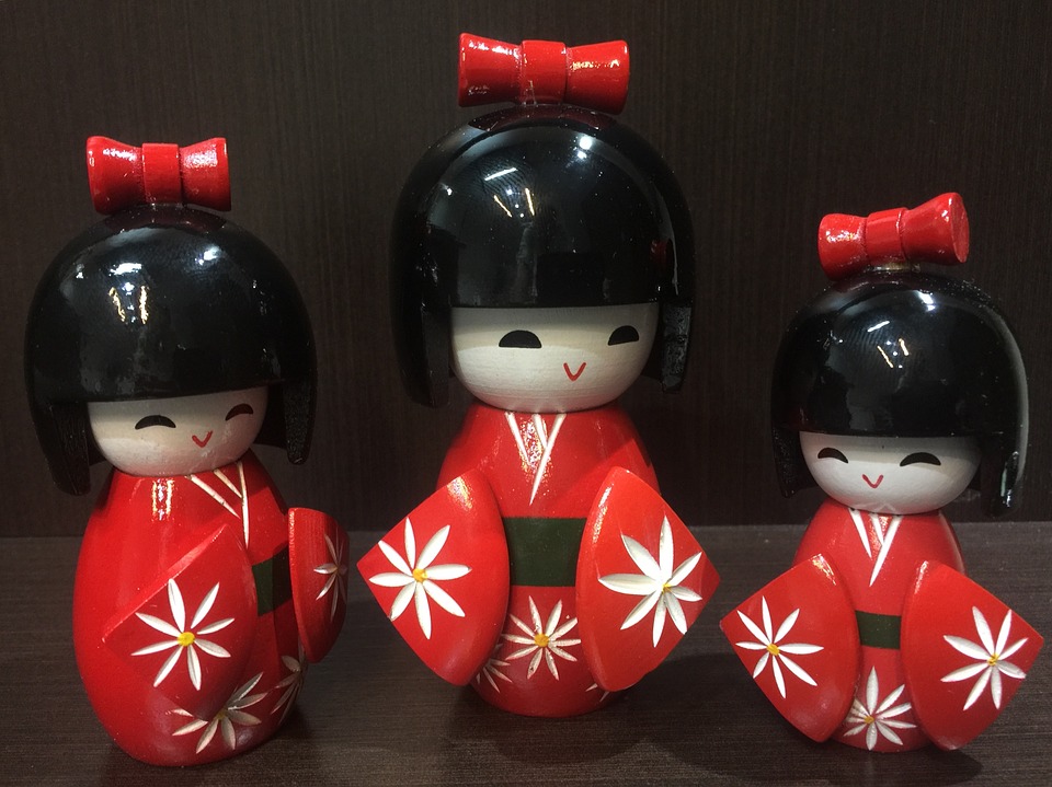 Three Japanese wooden dolls