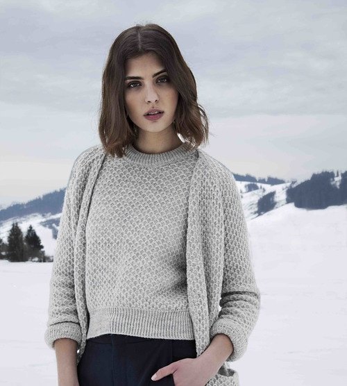 woman in grey sweater set with snowy background