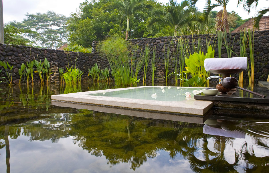 outdoor bath in the middle of a lotus pond