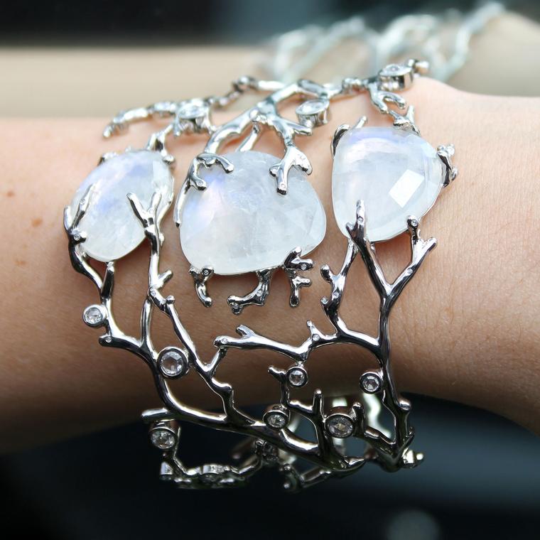 bracelet with opal stones set into silver on wrist