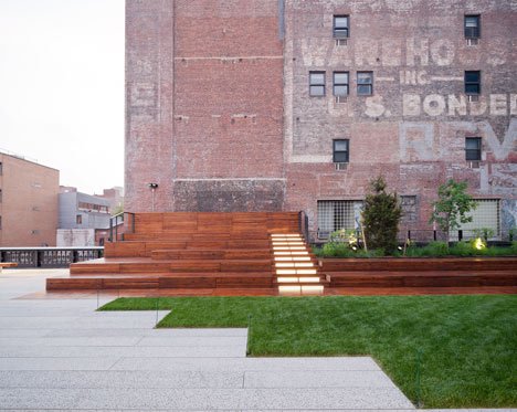 elevated wooden decking and grass surrounded by old buildings in New York City