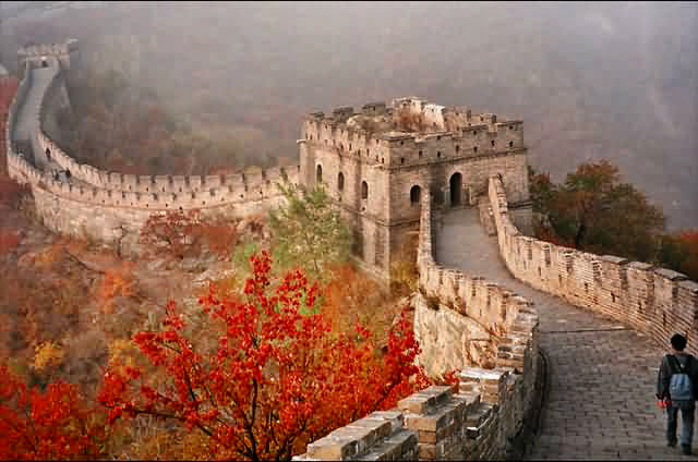 Great Wall of China with red autumn leaves