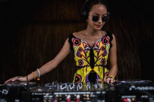 lady dj, sunglasses, mixing tunes