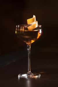 cocktail with lemon peel