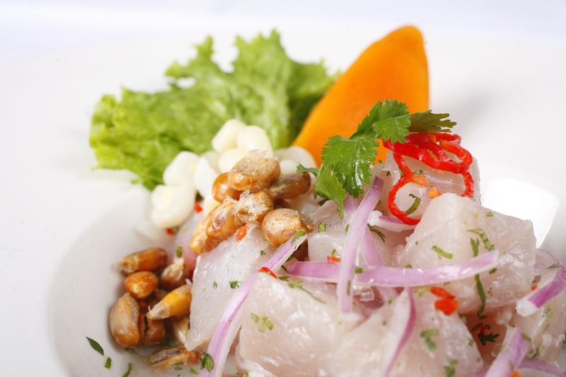 ceviche with red onion and green lettuce