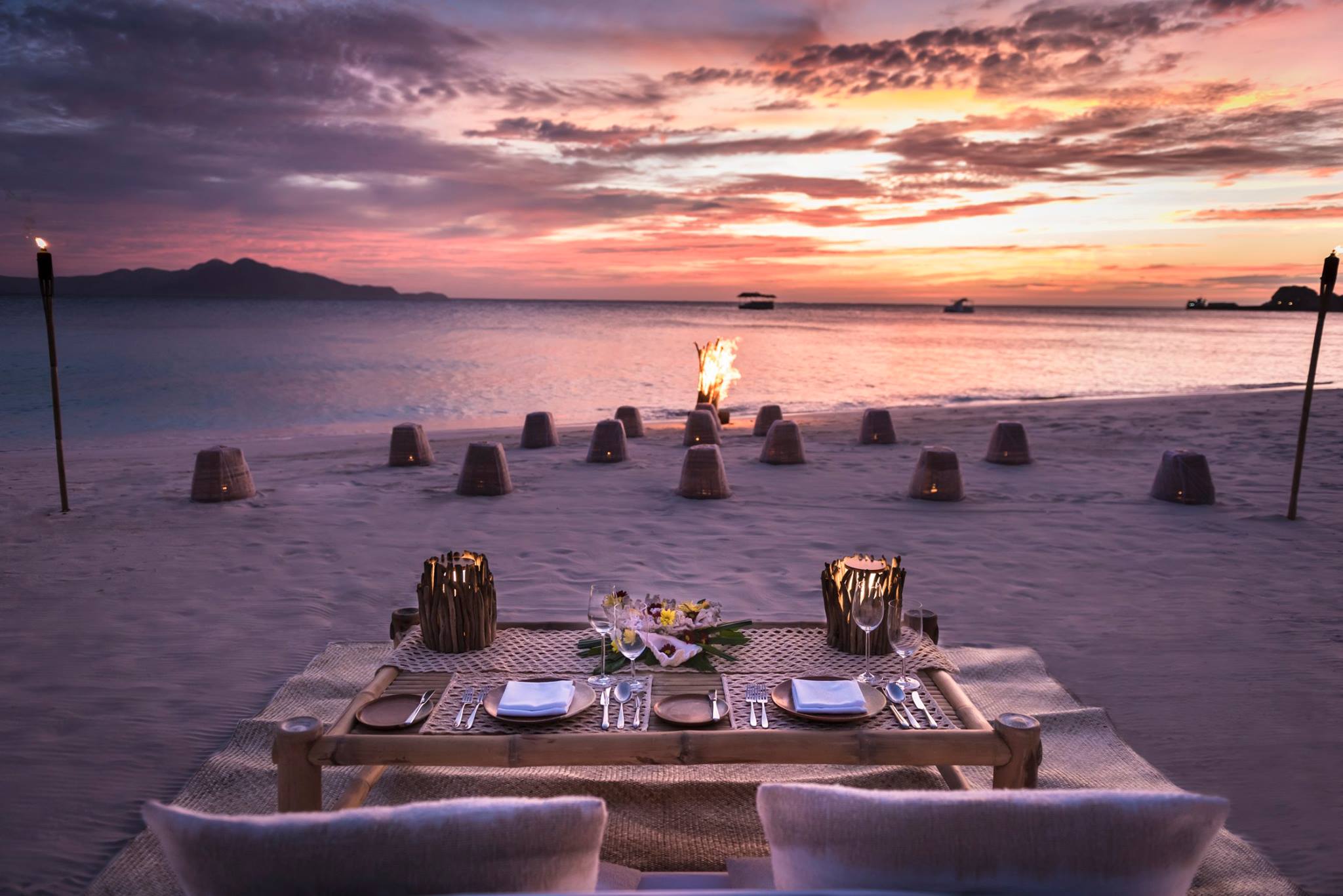 pink sunset dining on the beach