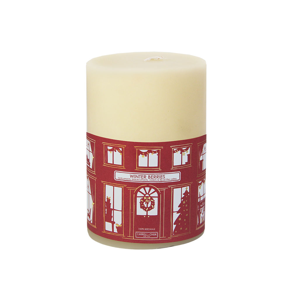 large pillar candle wrapped in red