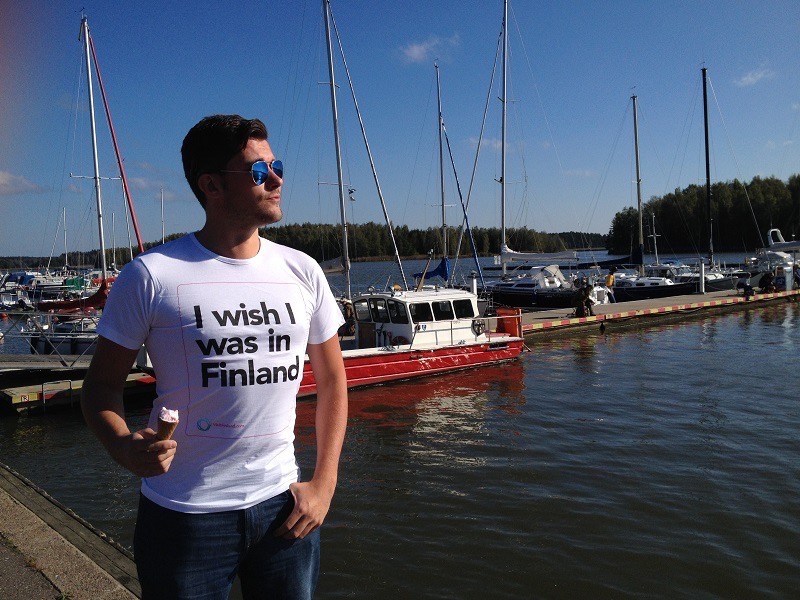 man with sunglasses wearing t-shirt that says" I wish I was in Finland"