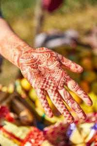 henna'd hand, outstretched palm up