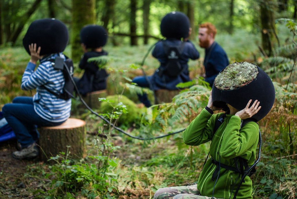 Wonderfruit participants experiencing virtual reality in nature